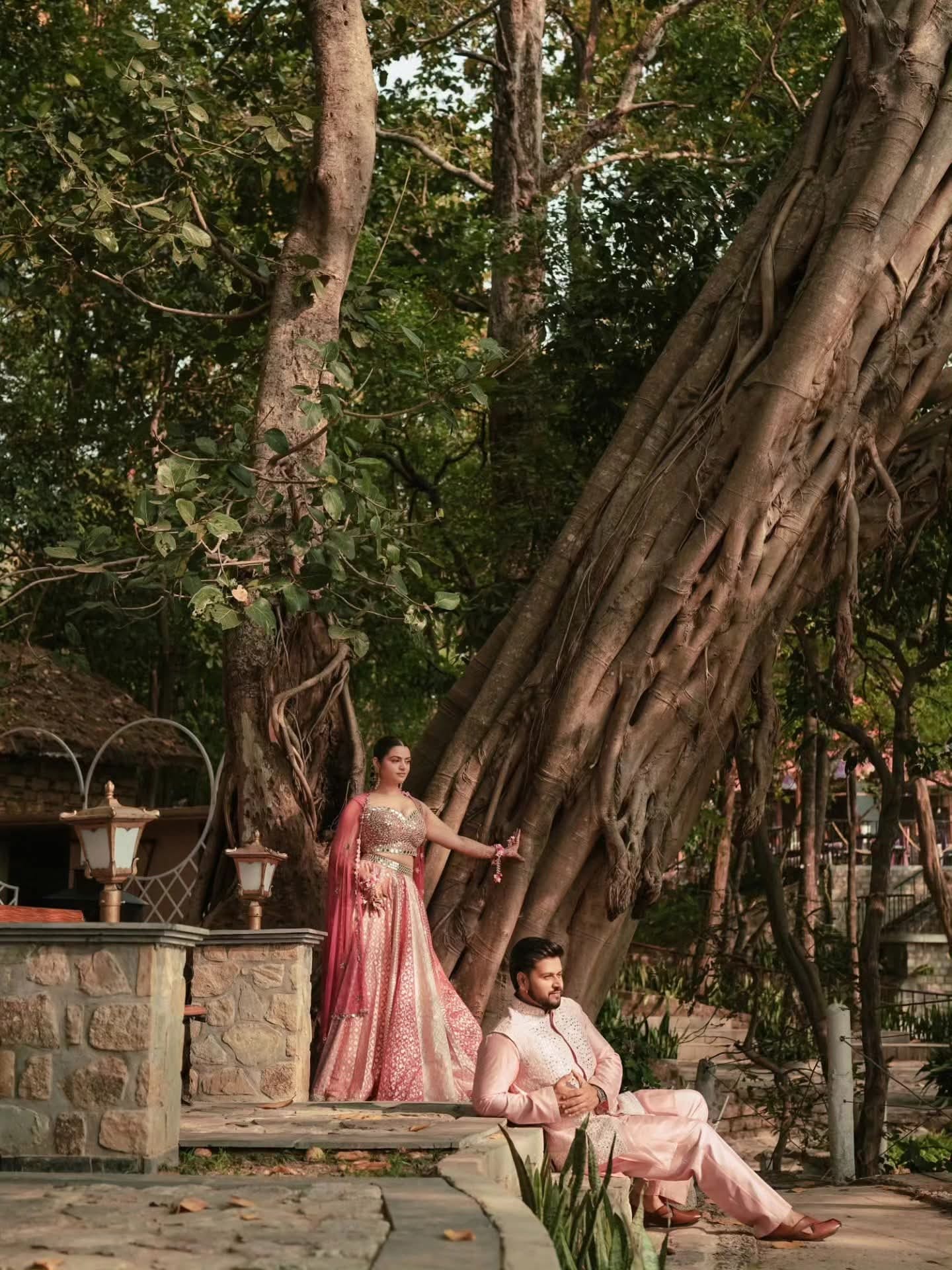 The couple beneath a banyan tree in the late afternoon
