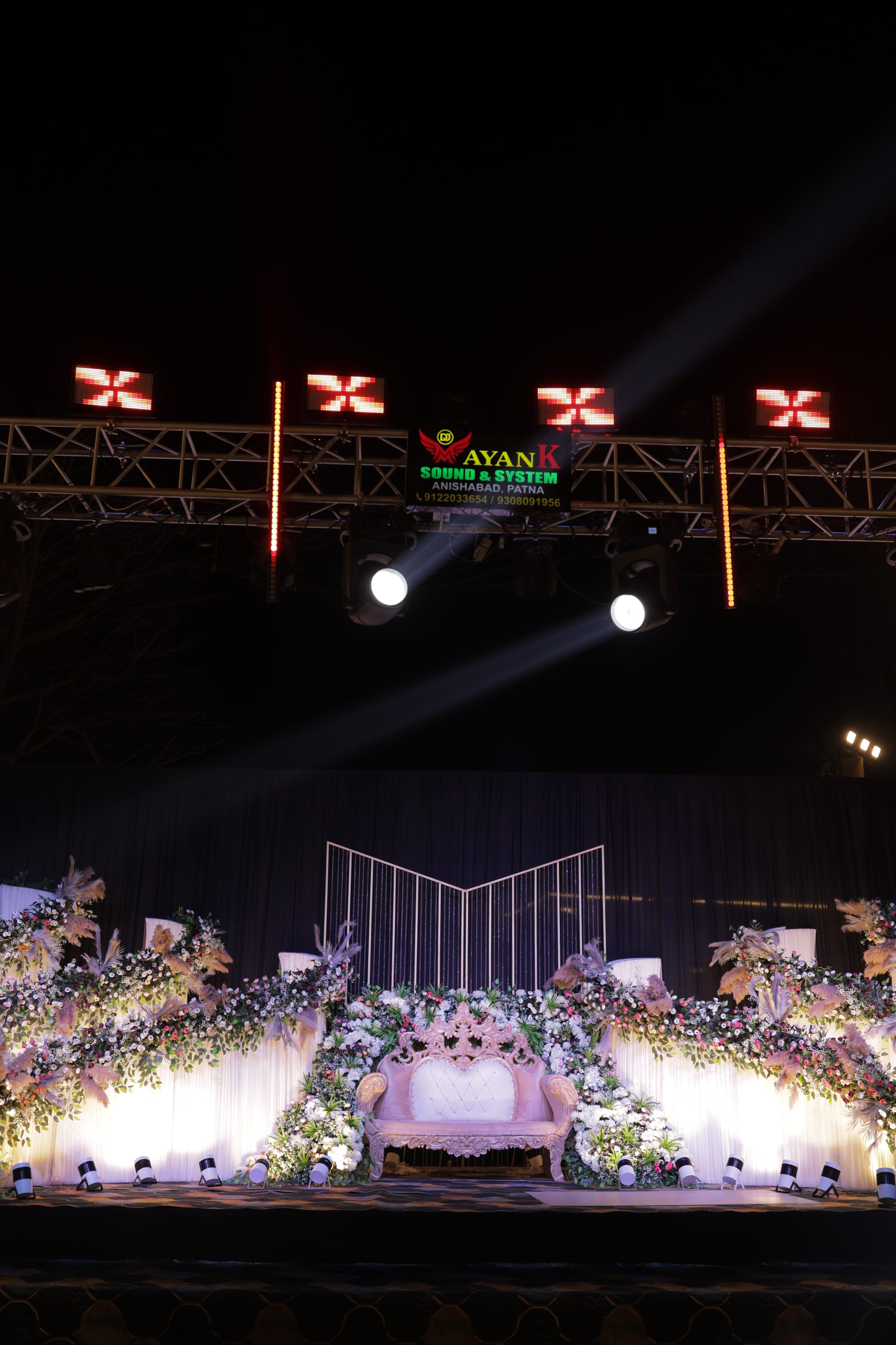 An outdoor stage with its lighting rig, shot during the night